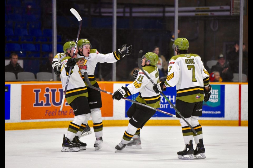 Battalion celebrate a goal against Barrie. Photo by Tom Martineau. 