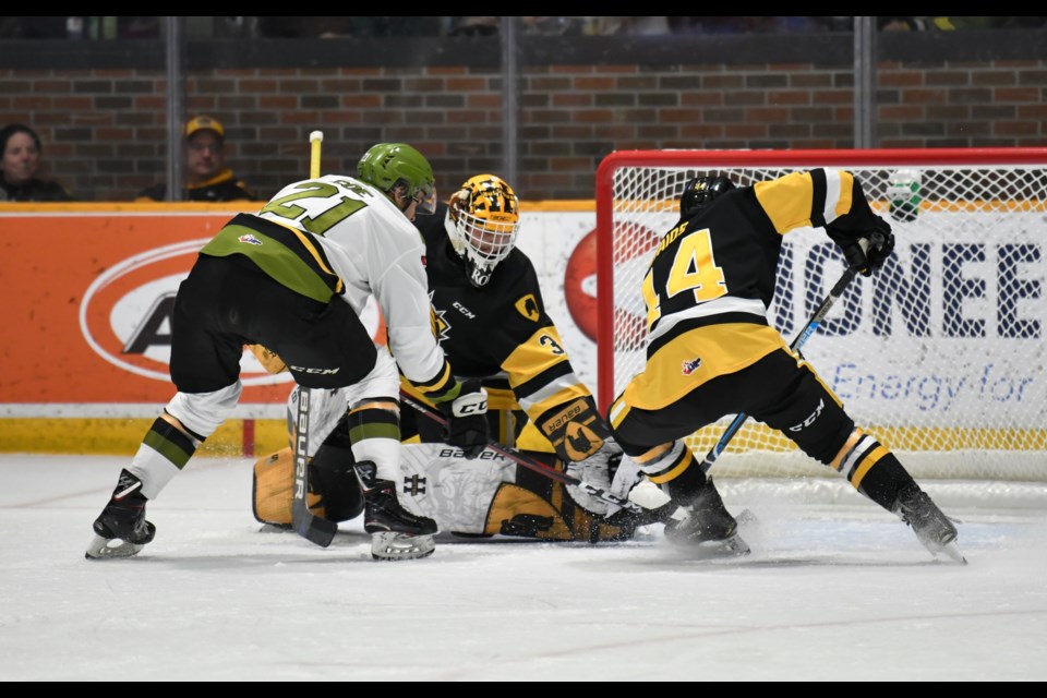Battalion with a chance in front of Callander native Zach Roy.   Photo by Tom Martineau/BayToday. 