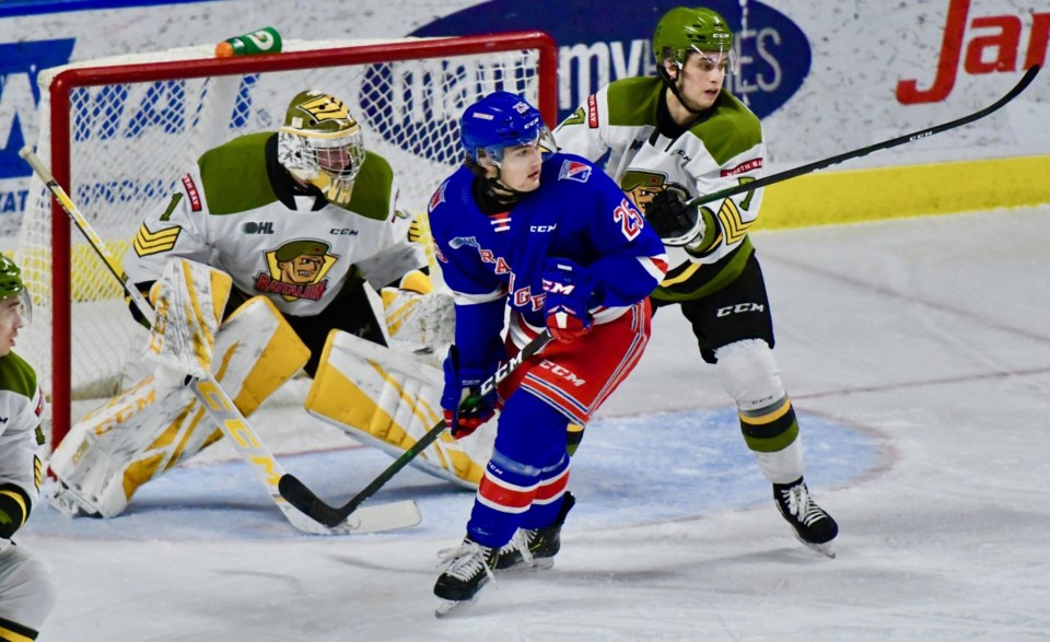 Simon Rose tries to defend his defensive zone against the Kitchener Rangers