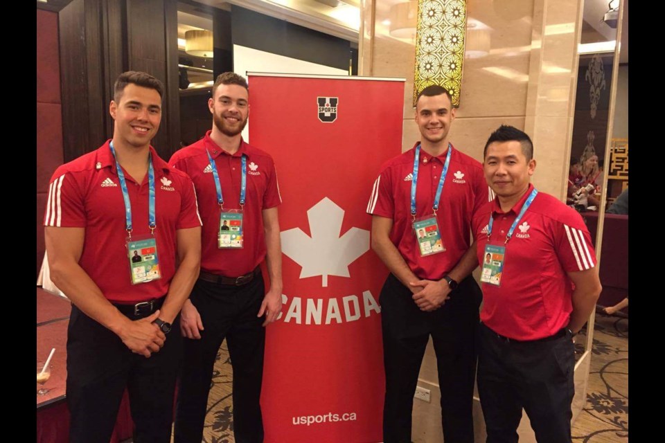 Eric Yung (far right) with three of his Nipissing Lakers Mens Volleyball players (from left to right Cam Branch, Steve Wood, Warren Taylor) as part of Team Canada at the 2017 FISU Games. 