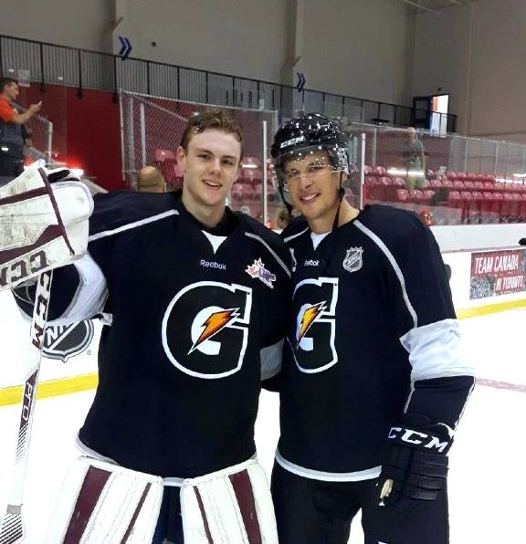 Nate McDonald poses with a photo at the Gatorade Camp with Sidney Crosby. Photo submitted.  
