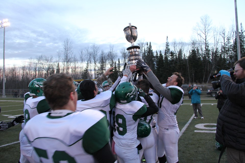 Trojans celebrate with the Poupore Cup.  Photo by Chris Dawson. 