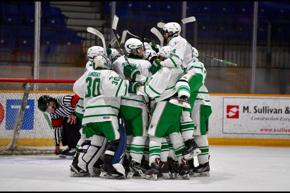Trojans celebrate a 6-1 win against the Bears in the NDA semifinals Sunday at Memorial Gardens.  Photo by Tom Martineau/BayToday.ca. 