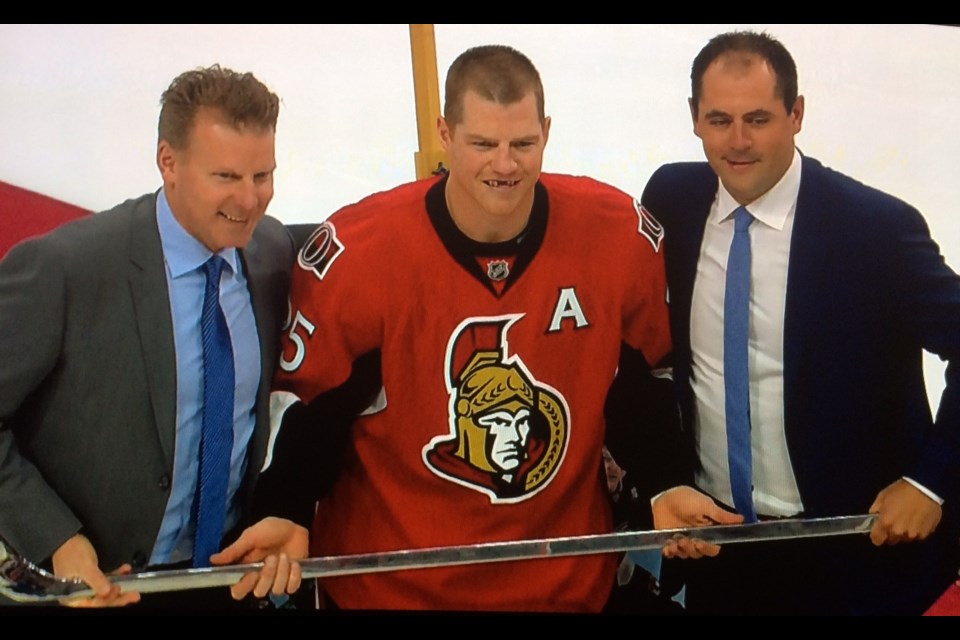 Senators legend Chris Neil's No. 25 being raised to the rafters in