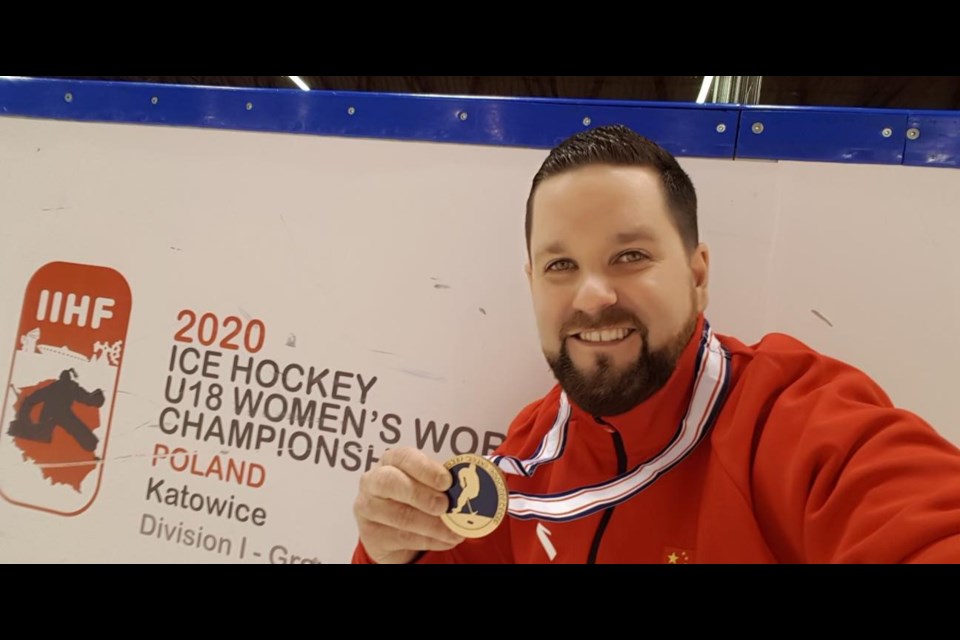 Joe Butkevich poses with the bronze medal he won with Team China at the U-18 World Championships in 2020. Photo by Joe Butkevich.  