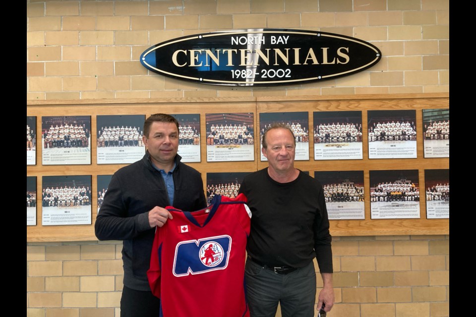 Vitali Yachmenev (left) and Guy Blanchard (right) at Memorial Gardens in North Bay. 