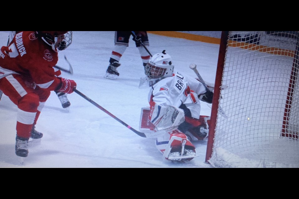Minor peewee AAA Trappers goalie Terry Bradley stretches across to make a save. Photo submitted. 