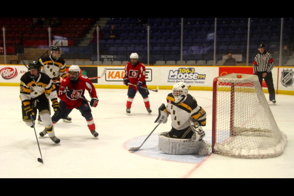 Trappers opportunity in front of Cubs goaltender Ty Sparling.  Photo by Chris Dawson.  