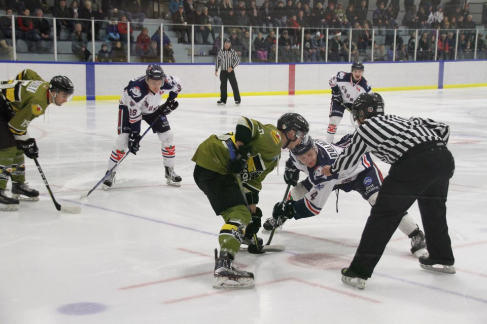 Dylan D'Agostino takes a draw in the Voodoos zone in the first period. Photo by Chris Dawson. 