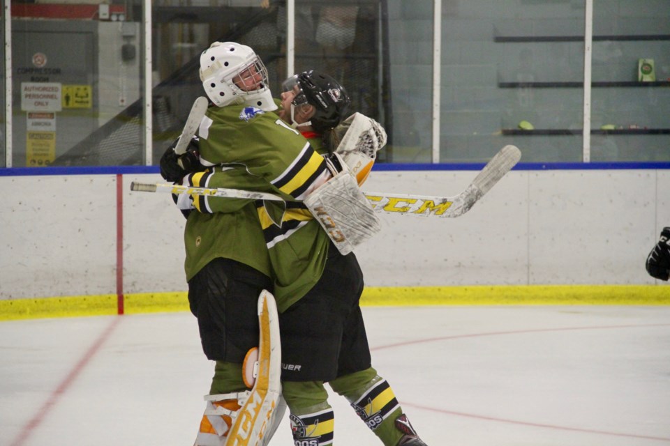 Celebration! Christian Cicigoi and Tomas Yachmenev embrace after an 8-2 win for the Voodoos over the Hearst Lumberjacks to improve to 3-0 on the season.  Photo by Chris Dawson/BayToday.ca 