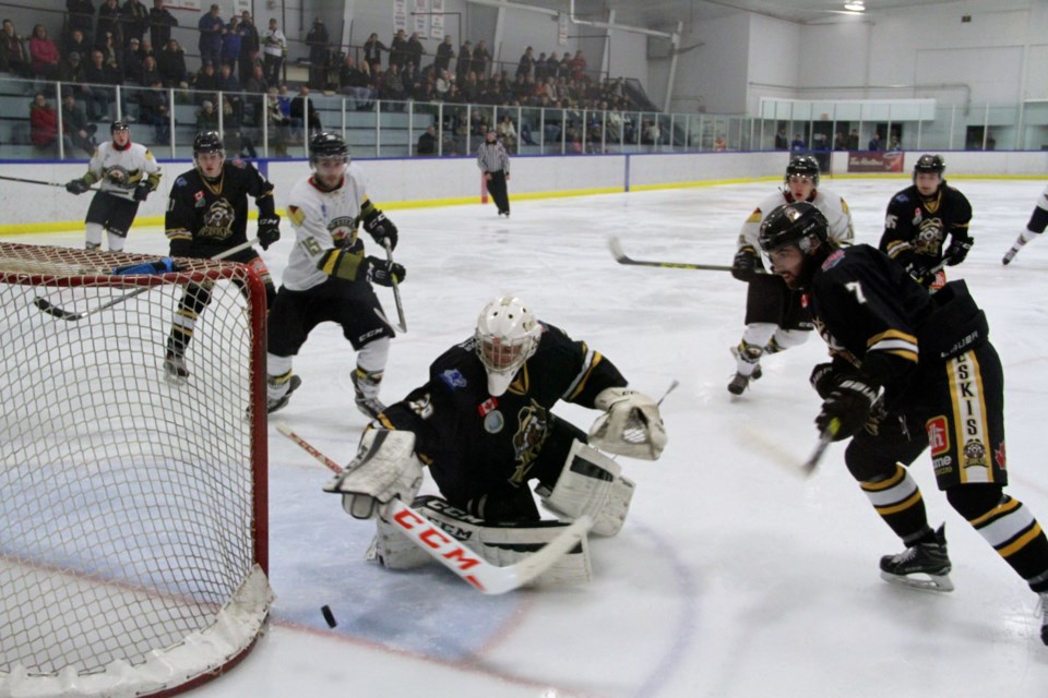 Ryan Theriault (15) had two goals and two assists in the Voodoos' 10-3  win over Iroquois Falls. Here, he heads to the net as Eskis goalie Trevor Hawkes searches for the loose puck. Photo by Chris Dawson.