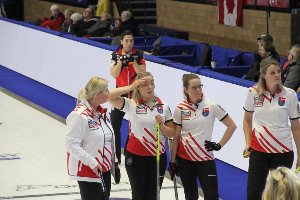 Denmark calls a timeout in the 8th to try to avoid an eventual four for Canada.  Photo by Chris Dawson. 