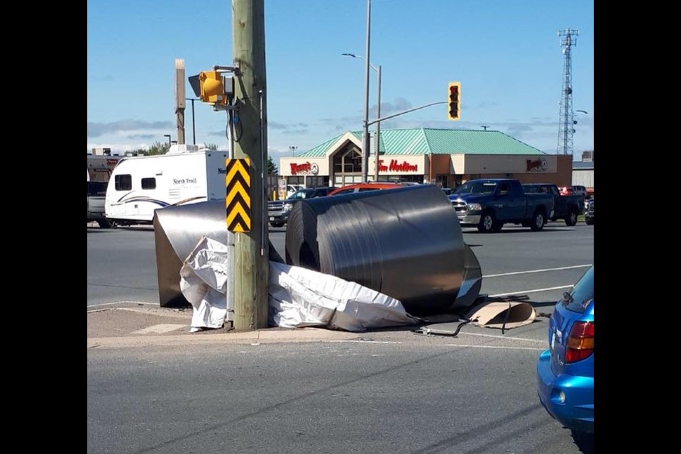 A giant steel coil fell off a transport at a busy Soo intersection. Photo courtesy Josh Jarvis. 
