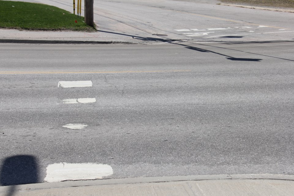 Road markings at the intersection of Lakeshore and Marshall are showing their age.