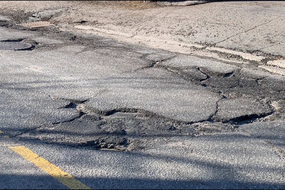 The entire stretch of Premier Road is in need of resurfacing. File photo.