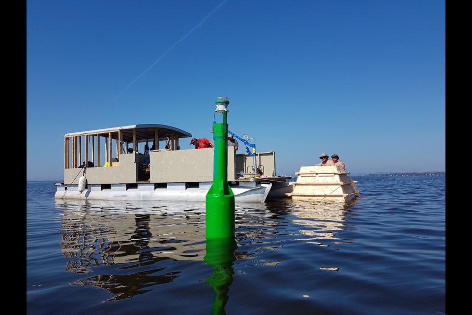 The Coast Guard is presently doing maintenance on Lake Nipissing buoys.  Photo courtesy Neil Brown.