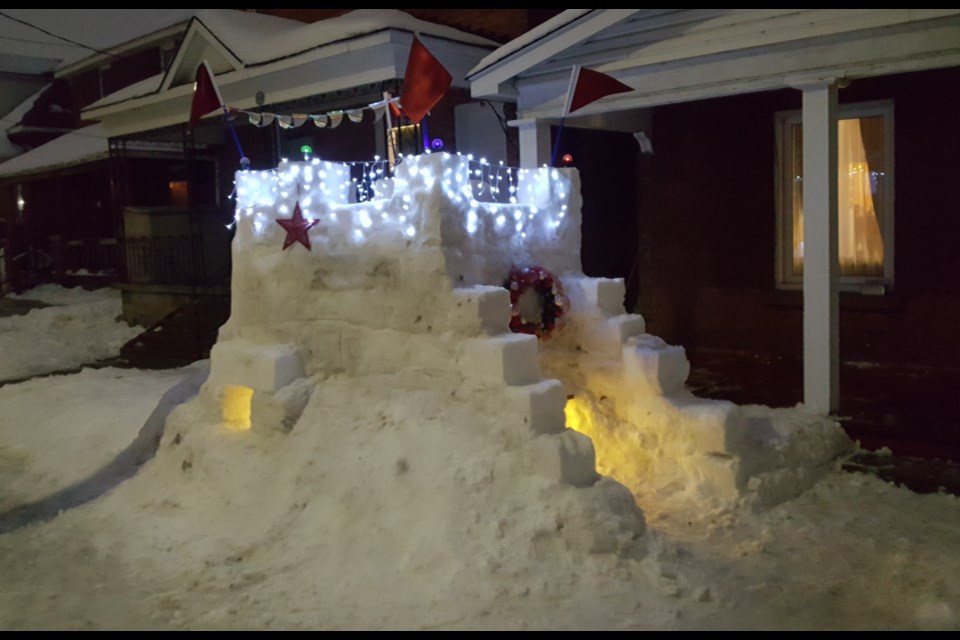 Lights and flags on this snow castle on Second Ave. in North Bay give it a magical quality. Courtesy Andrew Lindsay.