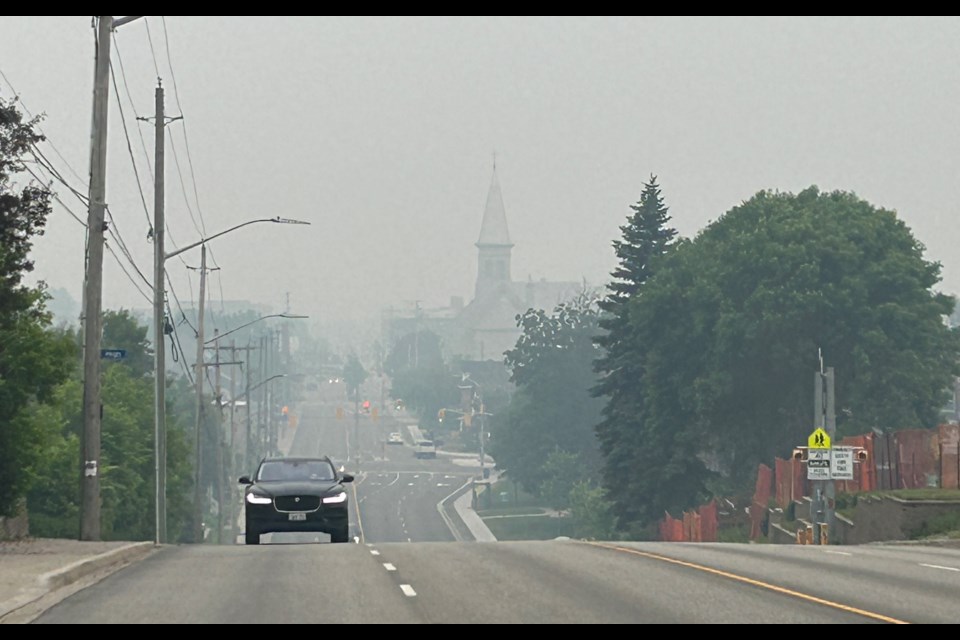 Heavy smoke shrouds the steeple of the Pro Cathedral in North Bay as smoke from forest fires blankets the area.