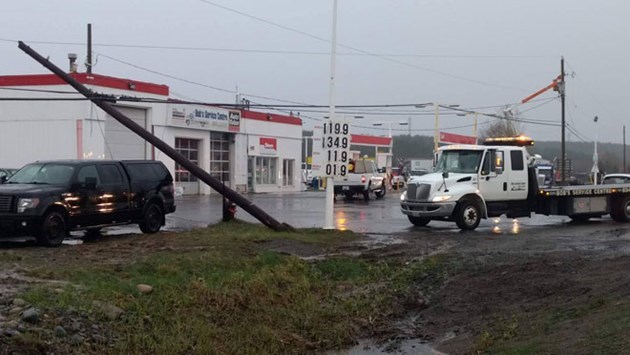 A hydro pole was snapped off at Bob's Service Centre near Coniston yesterday after a severe thunderstorm. Thousands are still without power in Greater Sudbury this morning. (Mark Gentili/Sudbury.com)