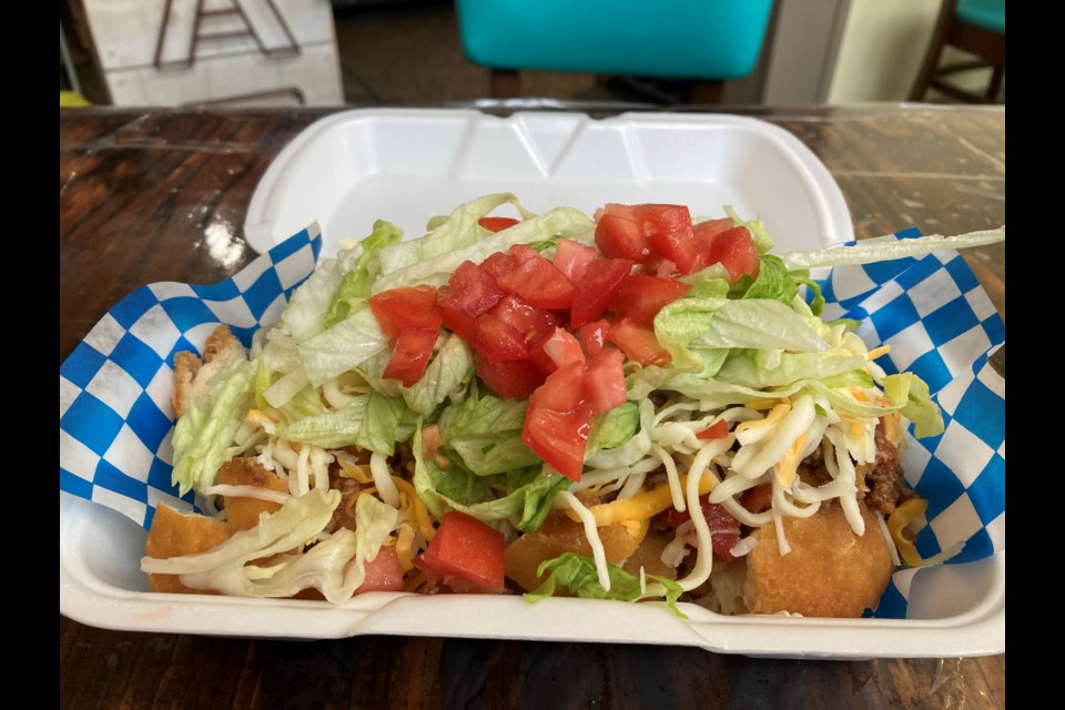 Taco Tuesday at Oak East Eatery where toppings are layered over Indigenous fried bread instead of tortilla shells.