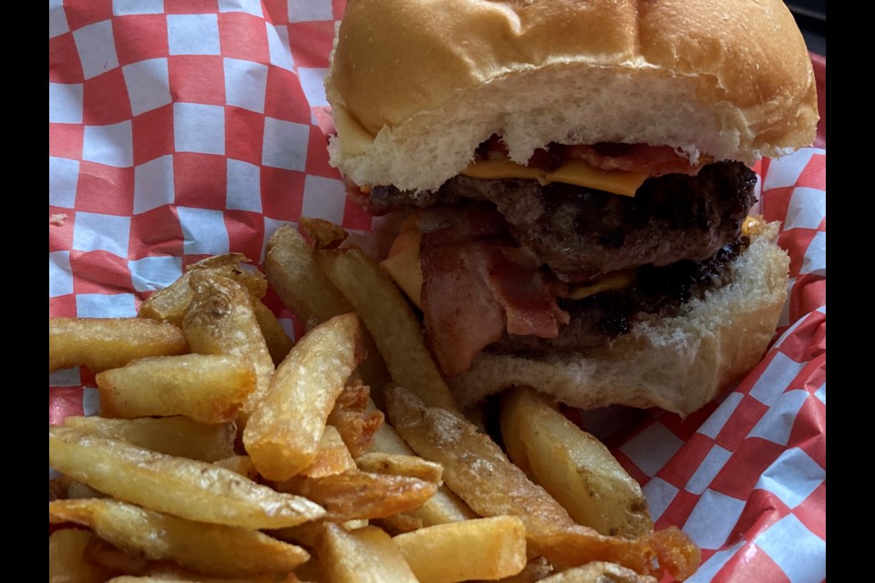 The bacon double cheeseburger is a hit with customers at The Fork Chip stand 