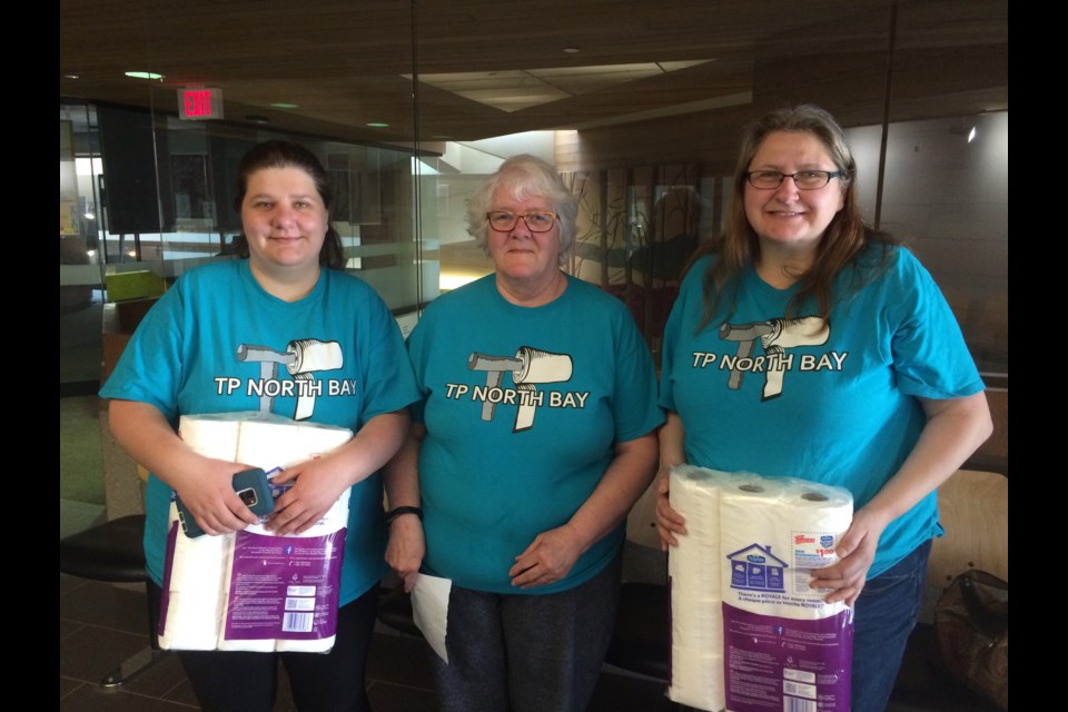 (l-r) Melissa Byerlay, Ellen Faulkner,  and Dorothy Byerlay of TP North Bay remind the public that time is running out to collect 20,000 rolls of toilet paper for local food banks