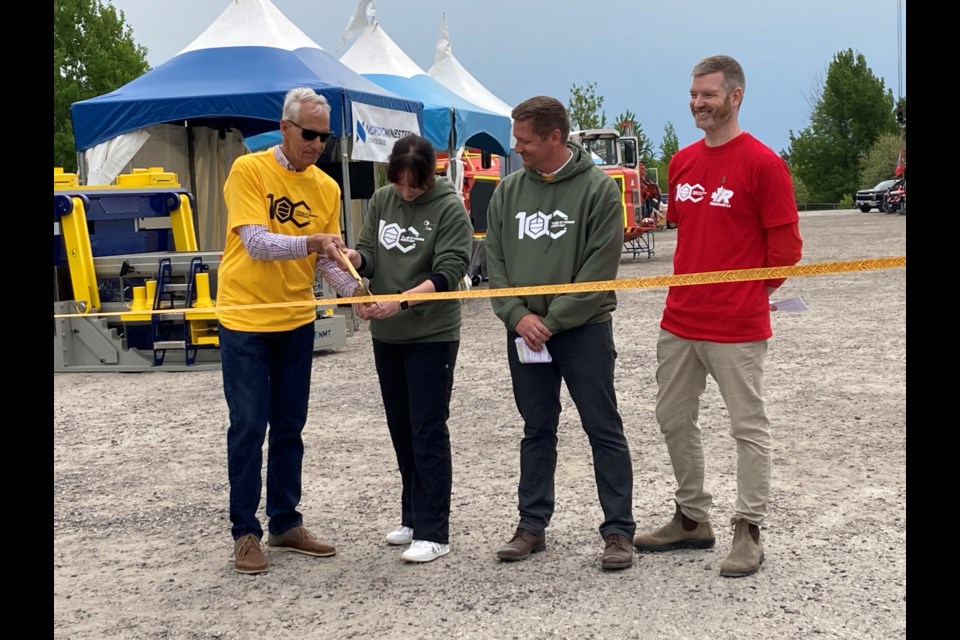 (l-r) North Bay Mayor Peter Chirico, 
Rachel Cranford chair for 100 Years of mining CIM Northern Gateway branch, Mark Wagner  President of the Northern Gateway Branch of CIM and  Tyler Foy, manager of engineering and technical services at Redpath at the official opening of 100 years of mining North Bay celebration 