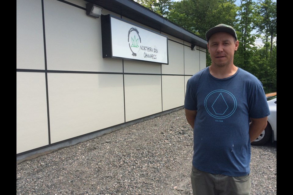 Zachary Lacelle stands outside his newly opened recreational cannabis dispensary on NFN
Photo: Linda Holmes