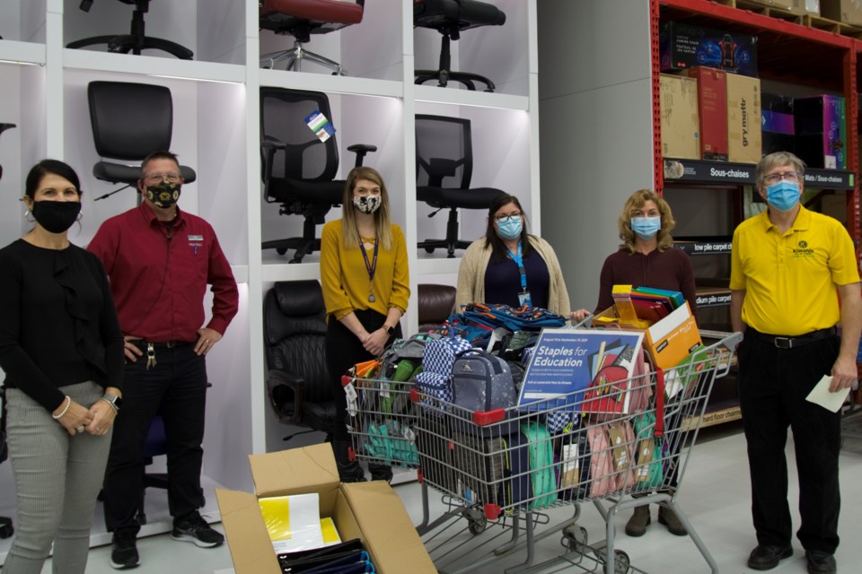 (From left) Gisele Heber of the Children’s Aid Society, Staples manager Pat Lynch, Jessica Foy of One Kids Place, Paula Barnes and Tammy Szarka of the FamilyHelpNetwork.ca, and Ralph Celentano of the Kiwanis Club. / Photo David Briggs 