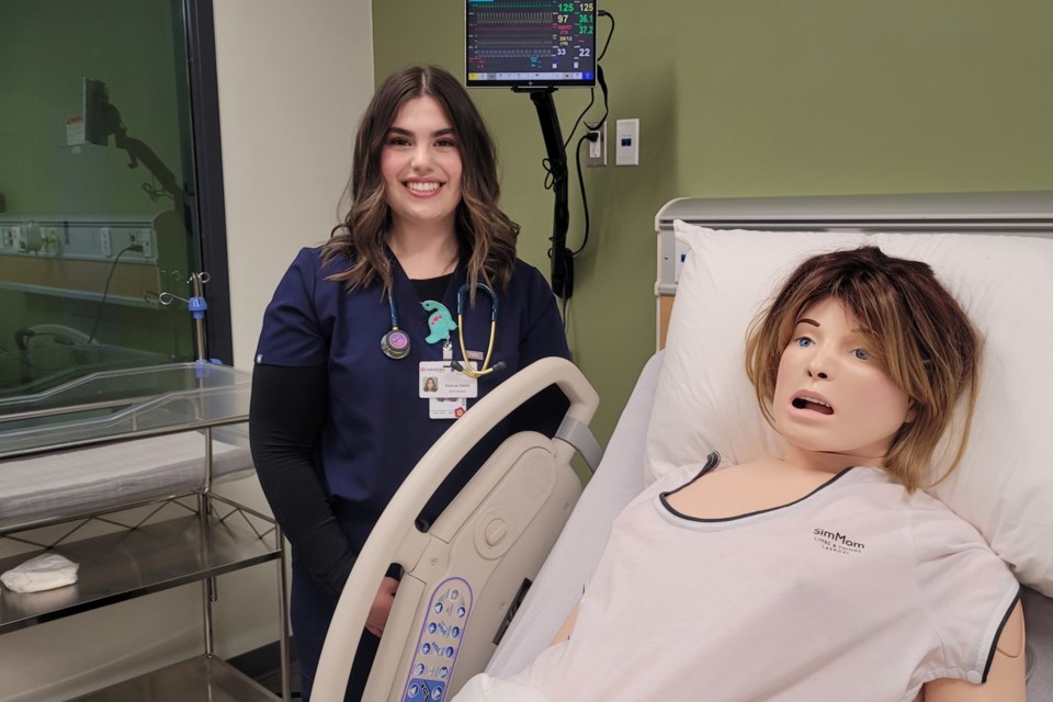 Vanessa Cimino takes time to pose with one of the program's new 'patients'