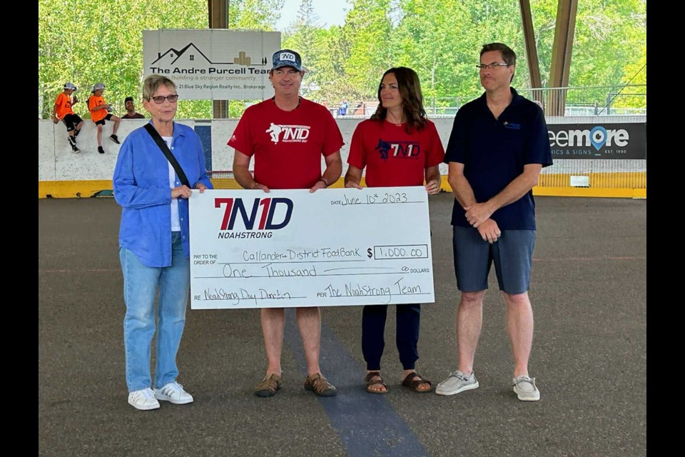 Organizers of the NoahStrong Ball Hockey Tournament present a big cheque to Callander's food bank / Photo by Chris Dawson