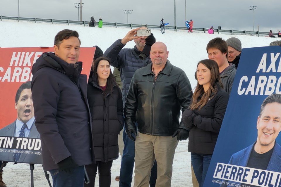 Conservative Leader Pierre Poilievre stopped in North Bay this afternoon on his 'Axe the Tax' tour. Local Conservative candidates Steven Trahan (in the middle) and Cassidy Villeneuve (left of the sign) came out to support the cause 