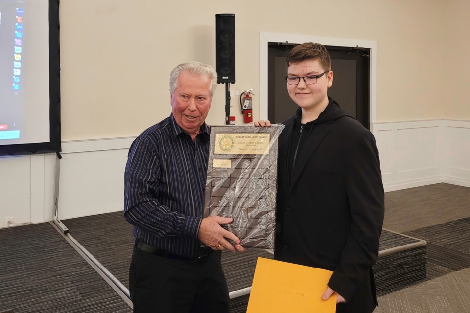 Henry Drenth presents Alex Hebert with an award for volunteerism / Photo David Briggs 