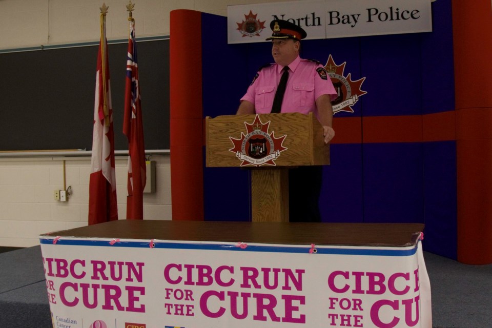 Deputy Police Chief Michael Daze dons pink to launch the upcoming CIBC Run for the Cure campaign / Photo David Briggs