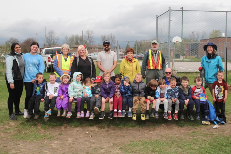 One of the kindergarten classes at Silver Birches Elementary helped plant six fruit trees this morning