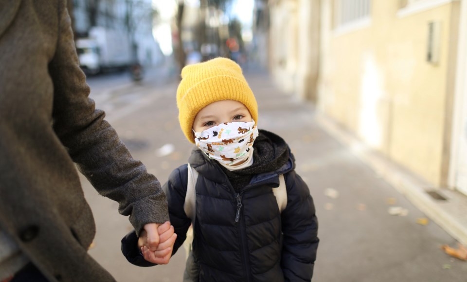 Child with COVID mask - catherine delahaye - getty images