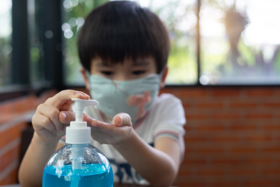 Boy hand sanitizer - getty images - krisanapong detraphiphat