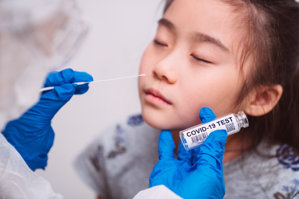 COVID testing girl - getty - Tang Ming Tung