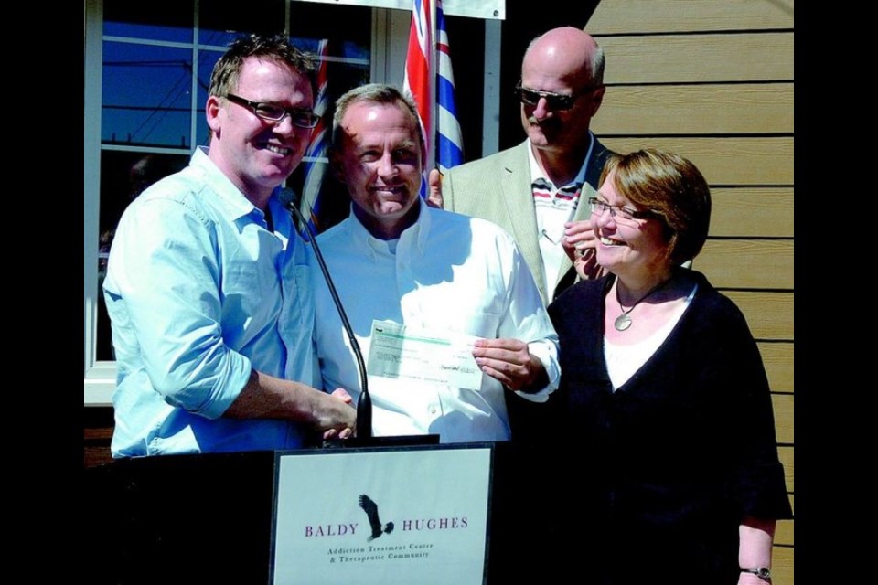 Baldy Hughes executive director Marshall Smith (white shirt) accepts a $500,000 donation from B.C. Liberal cabinet ministers Kevin Falcon, Pat Bell and Shirley Bond