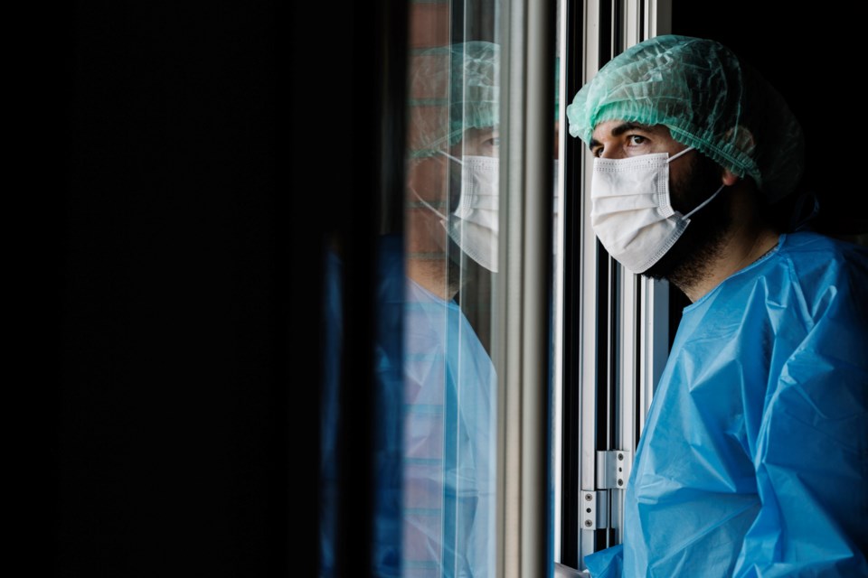Hospital worker window - getty images - Xavier Lorenzo