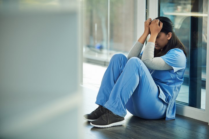 Stressed-health-care-worker-AJ_Watt-E-plus-Getty