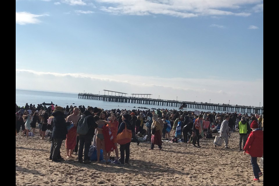 Thousands of people gathered in Coney Island to take a dip into the Atlantic Ocean on New Year's Day.