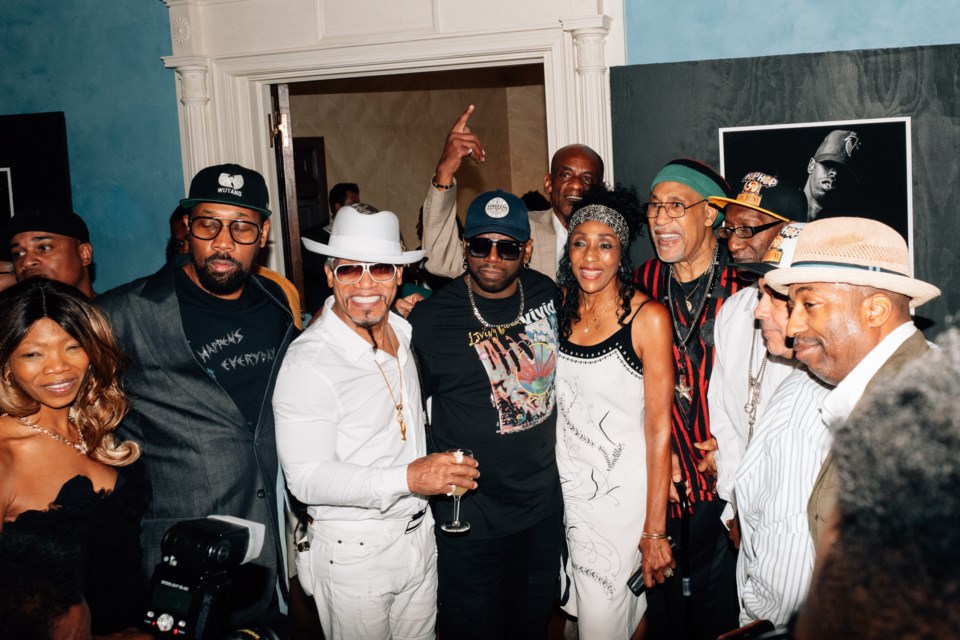 Old-school hip-hop artists pose for a photo at the Hip-Hop 50th Anniversary Breakfast Reception, held in Gracie Mansion.