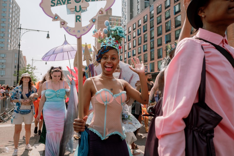 Parade participants marched along Surf Avenue during the 2023 Coney Island Mermaid Parade.