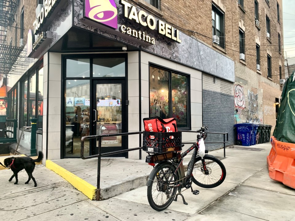 delivery-worker-bike-in-front-of-a-taco-bell-photo-credit-thao-nguyen-for-bk-reader