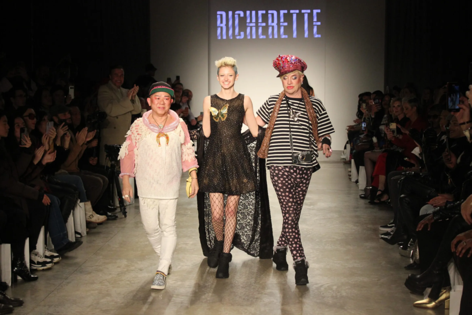 Richie Rich (right) walks with models for a final bow after the show. Photo: Miranda Levingston for BK Reader.
