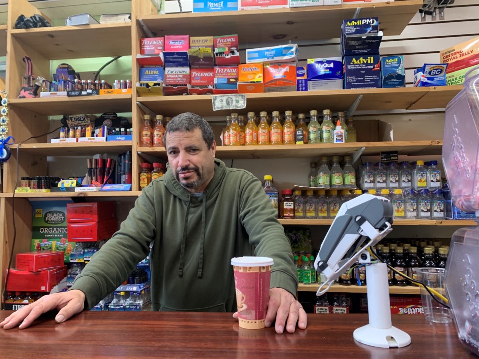jamal-sawaid-behind-his-counter-he-returned-to-his-store-just-two-days-after-the-attack-photo-credit-thao-nguyen-for-bk-reader