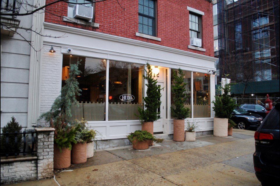 Huda sits on the corner of Leonard and Conselyea Streets in Williamsburg.