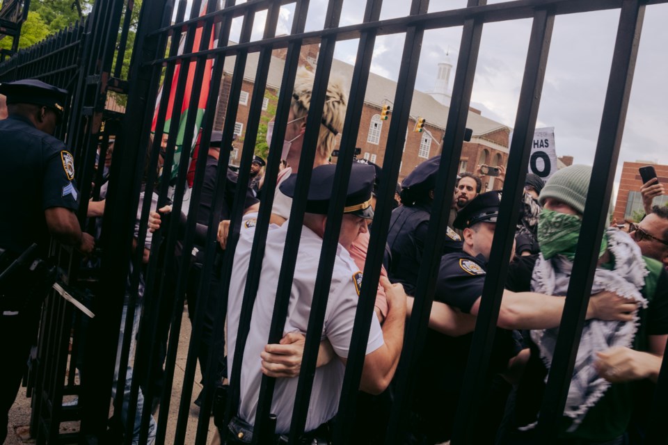 Pro-Palestinian students at Brooklyn College fighting arrest by police officers on May 8, 2025.