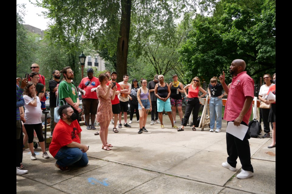  Michael Hollingsworth, an organizer with the Crown Heights Tenant Union, leads a rally on Aug. 26 in support of 10 residents facing eviction from their rent-stabilized apartments in Crown Heights.